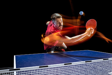 Image showing The table tennis player serving