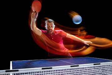 Image showing The table tennis player serving