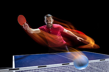 Image showing The table tennis player serving