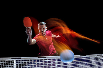 Image showing The table tennis player serving