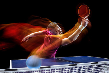 Image showing The table tennis player serving