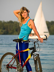 Image showing Female cyclist posing outdoors