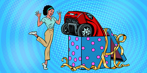 Image showing car holiday gift box. African woman funny reaction joy