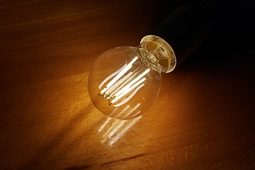 Image showing Light bulb on a table