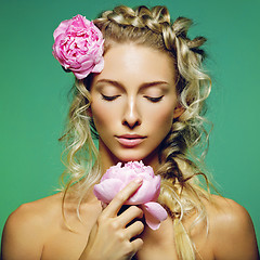 Image showing Beautiful girl with peony flower