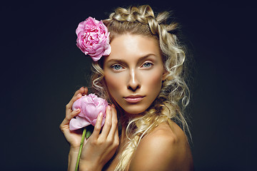 Image showing Beautiful girl with peony flower