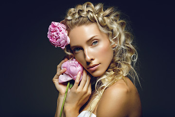 Image showing Beautiful girl with peony flower