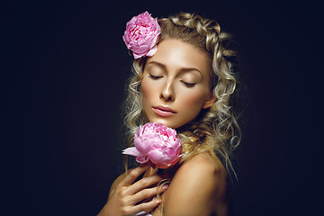 Image showing Beautiful girl with peony flower