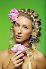 Image showing Beautiful girl with peony flower