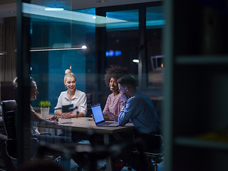 Image showing Multiethnic startup business team in night office