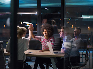 Image showing Multiethnic startup business team in night office