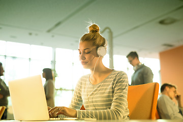 Image showing businesswoman using a laptop in startup office