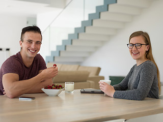 Image showing couple enjoying morning coffee and strawberries