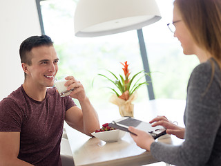 Image showing couple enjoying morning coffee and strawberries