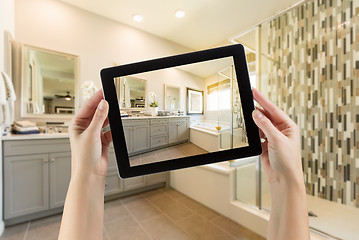 Image showing Master Bathroom Interior and Hands Holding Computer Tablet with 