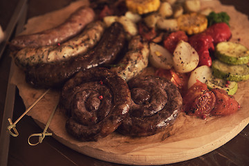 Image showing Grilled sausage with vegetables