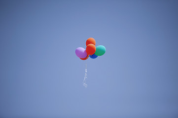 Image showing Colorful balloons flying in the sky