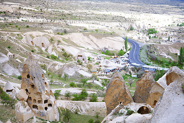 Image showing Travel bus station with crowd of people in rocky valley of Cappa