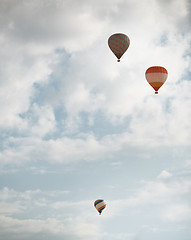 Image showing Three air balloons flying in the sky