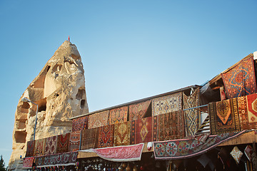 Image showing Outdoors shop with carpets for sale