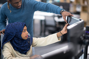 Image showing young black muslim female software developer at work