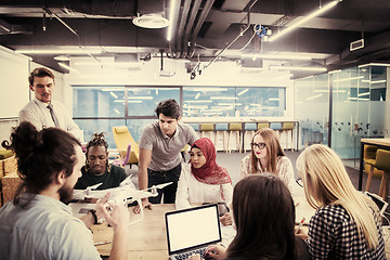 Image showing multiethnic business team learning about drone technology