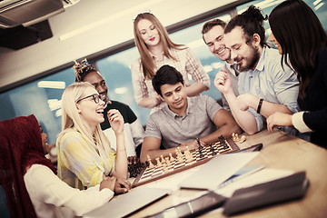 Image showing multiethnic group of business people playing chess