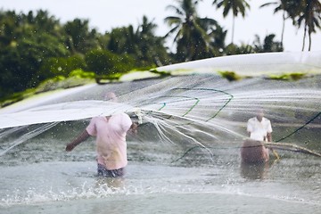 Image showing Fishermen with fishing net