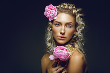 Image showing Beautiful girl with peony flower
