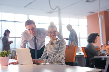 Image showing Two Business People Working With laptop in office