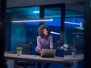 Image showing black businesswoman using a laptop in startup office