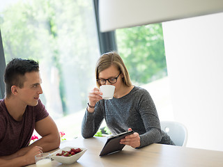 Image showing couple enjoying morning coffee and strawberries