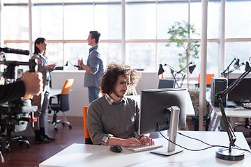 Image showing businessman working using a computer in startup office