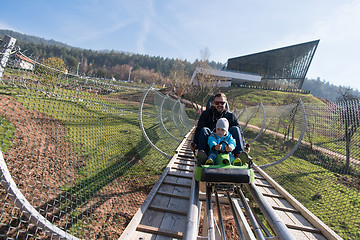 Image showing father and son enjoys driving on alpine coaster