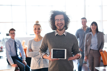 Image showing Portrait of a young businessman holding tablet