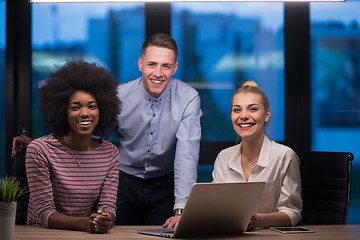 Image showing Multiethnic startup business team in night office