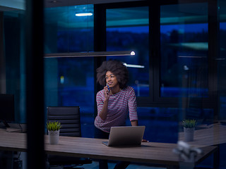 Image showing black businesswoman using a laptop in startup office