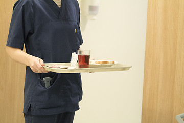 Image showing Nurse Serving Lunch