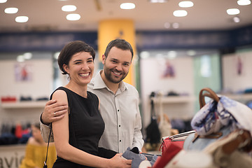 Image showing couple chooses shoes At Shoe Store