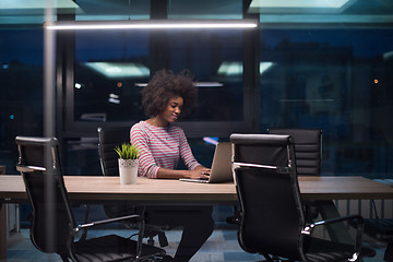 Image showing black businesswoman using a laptop in startup office