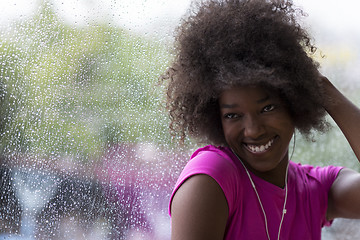 Image showing portrait of young afro american woman in gym while listening mus