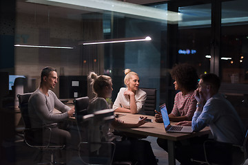 Image showing Multiethnic startup business team in night office