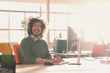 Image showing businessman working using a computer in startup office