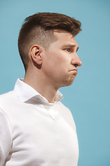 Image showing Beautiful bored man isolated on studio background