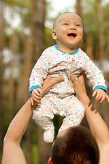 Image showing Baby Boy or Girl Have Fun Outdoors