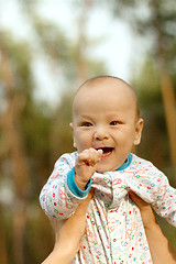 Image showing Baby Boy or Girl Have Fun Outdoors