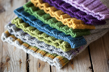 Image showing Multicolor knitted hats stack