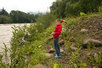 Image showing Boy Throw Stones In The River