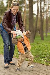 Image showing Baby Learning to Walk in Park