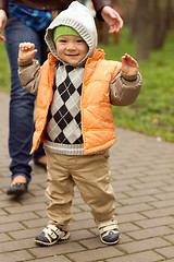 Image showing Baby Learning to Walk in Park